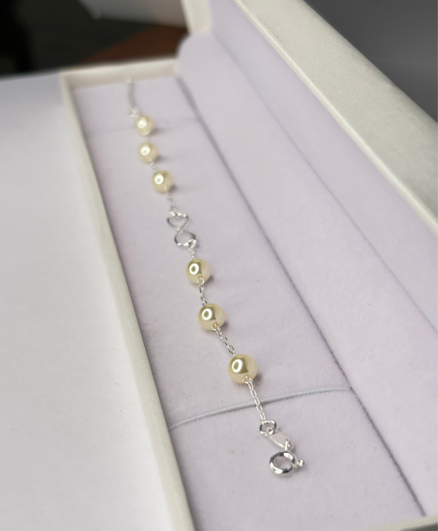 Pulsera perlas e infinito