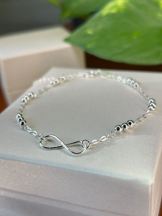 Pulsera infinito con mini esferas