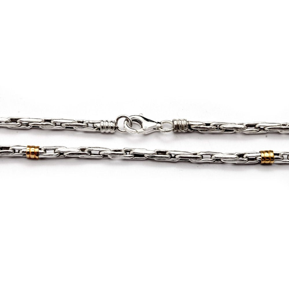 Cadena tourbillon plata y oro