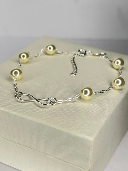 Pulsera perlas e infinito