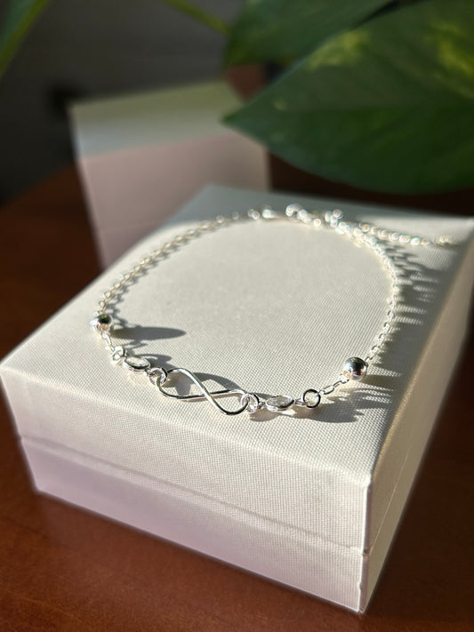 Pulsera infinito y puntos de luz