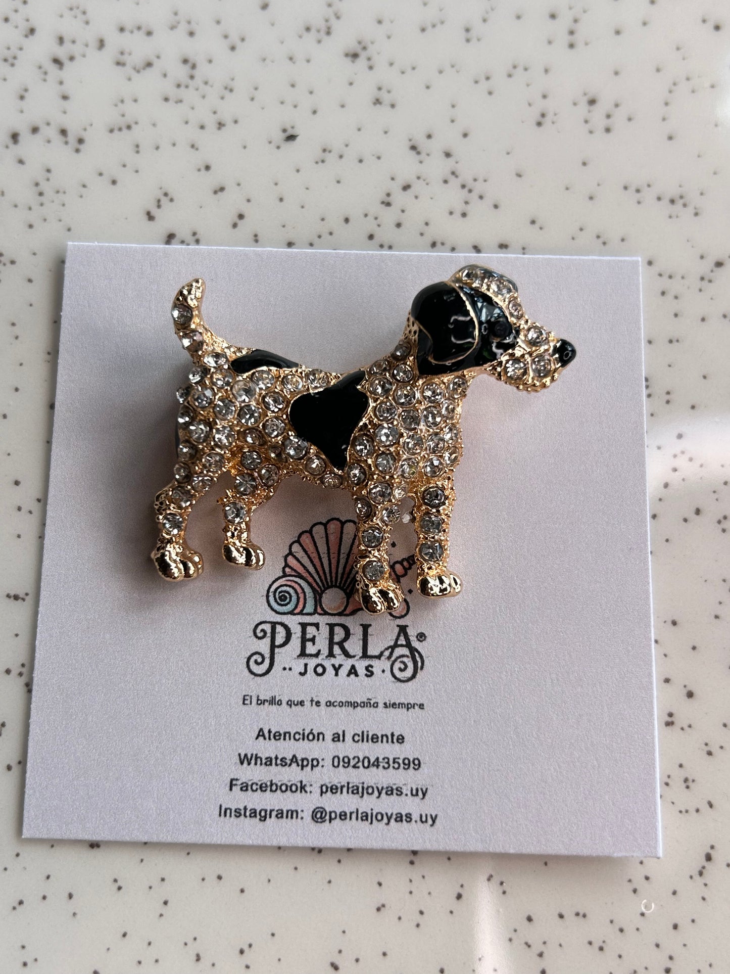 Prendedor perrito manchas