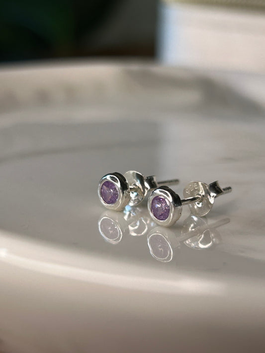 Caravanas punto de luz violeta