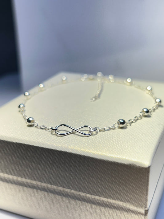 Pulsera infinito y esferas